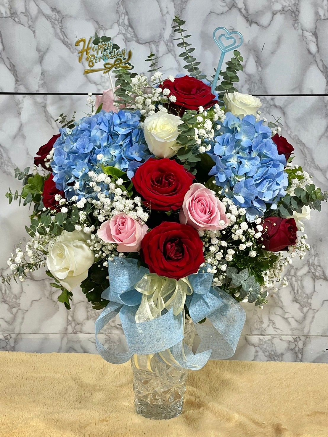 Blue hydrangea and rose