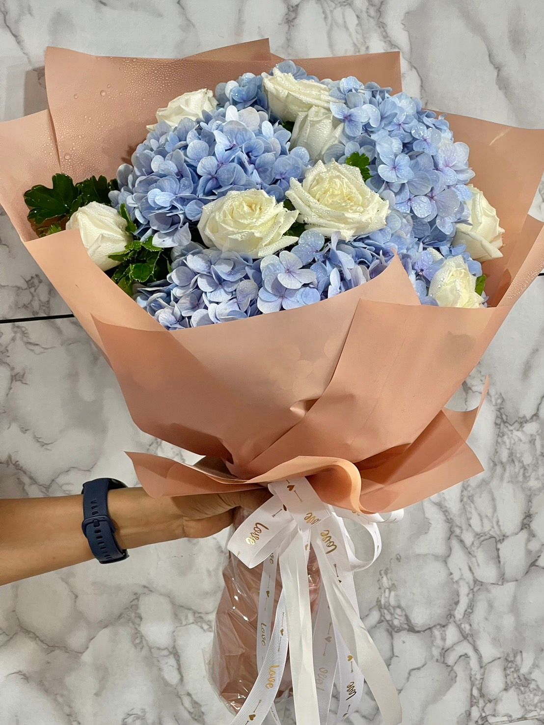 Blue hydrangea with white rose